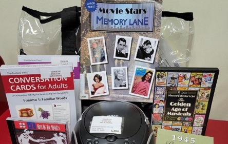 memory kit showing items coversation cards for adults, cd player, dvd, cd, 1950 movie star book