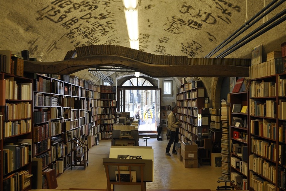 Library full of books and shelves.