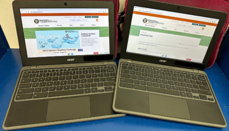 photo of two open Chromebook laptops