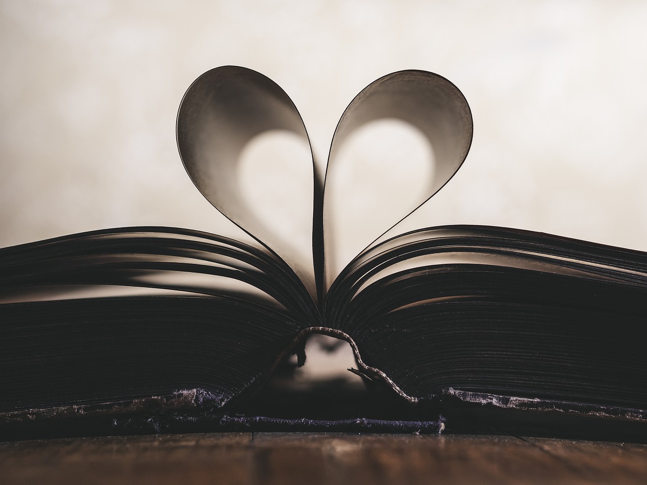 book with pages made into heart.